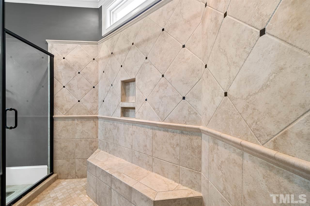 12515 Tuscan Lake Road Raleigh, NC 27613 - Photo 23 of 30 a bathroom with a shower and a toilet