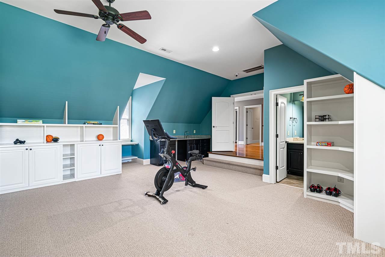 12515 Tuscan Lake Road Raleigh, NC 27613 - Photo 28 of 30 a view of a room with gym equipment