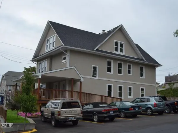 a car parked in front of a house