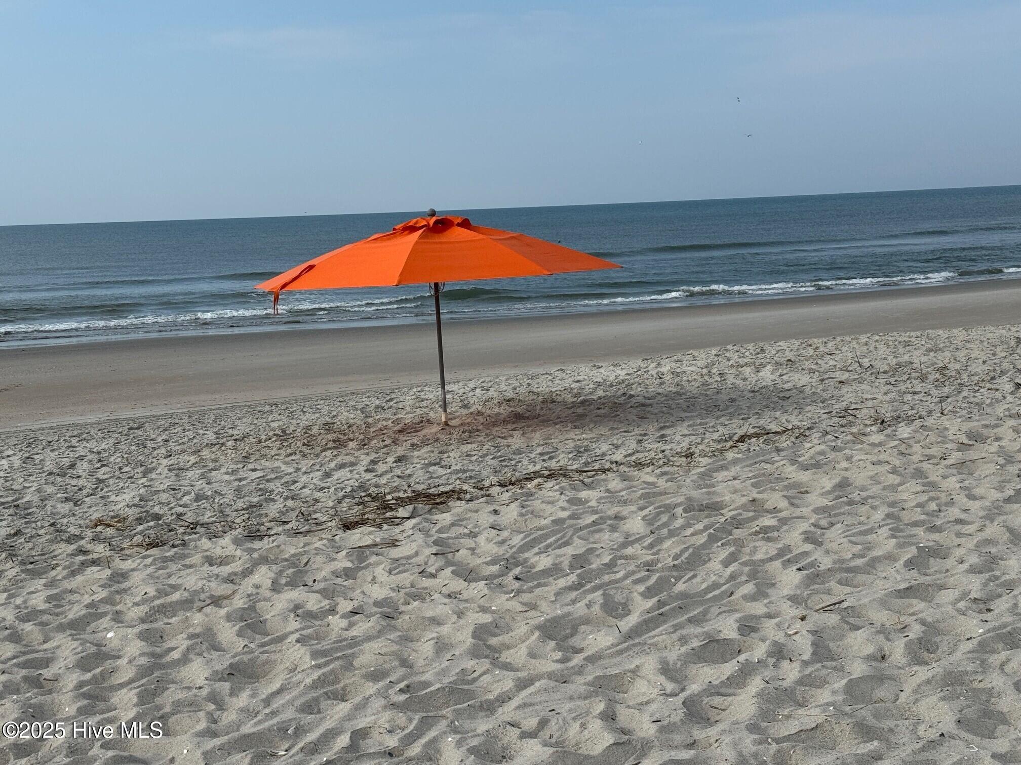 1135 Park Road Southwest, Unit 4302 Sunset Beach, NC 28468 - Photo 48 of 53 Beach pic with umbrella