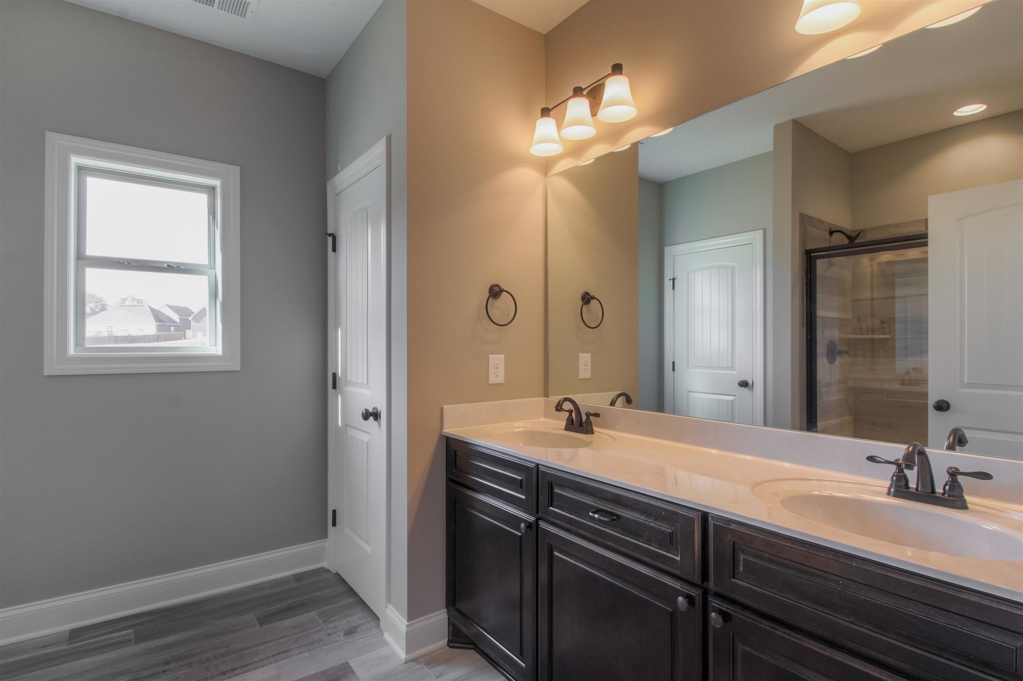 5 Bates Road Lebanon, TN 37087 - Photo 8 of 15 a bathroom with a double vanity sink and a mirror
