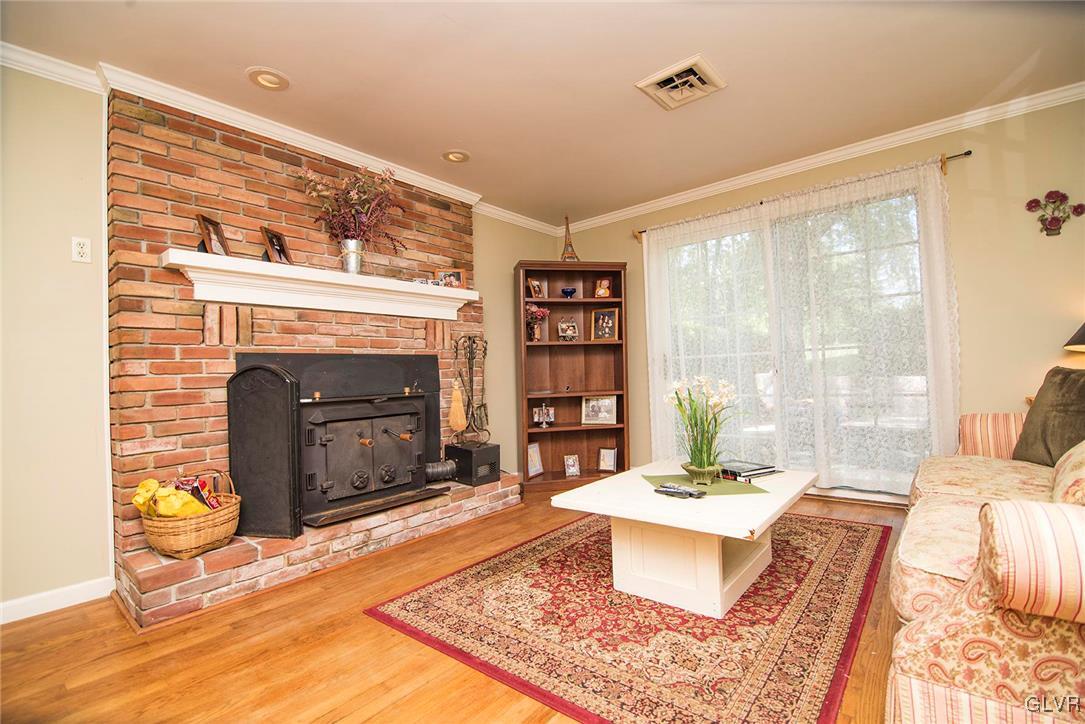 650 Williams Road Nazareth, PA 18064 - Photo 14 of 44 a living room with a couch and a fireplace