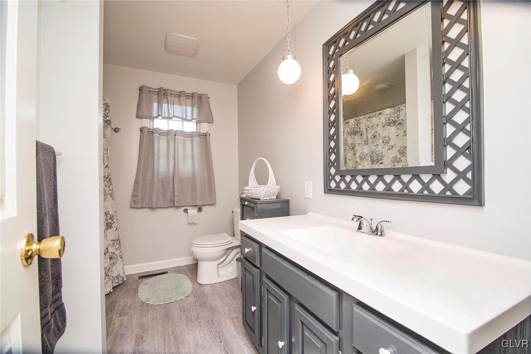 650 Williams Road Nazareth, PA 18064 - Photo 18 of 44 a bathroom with a sink mirror and a toilet
