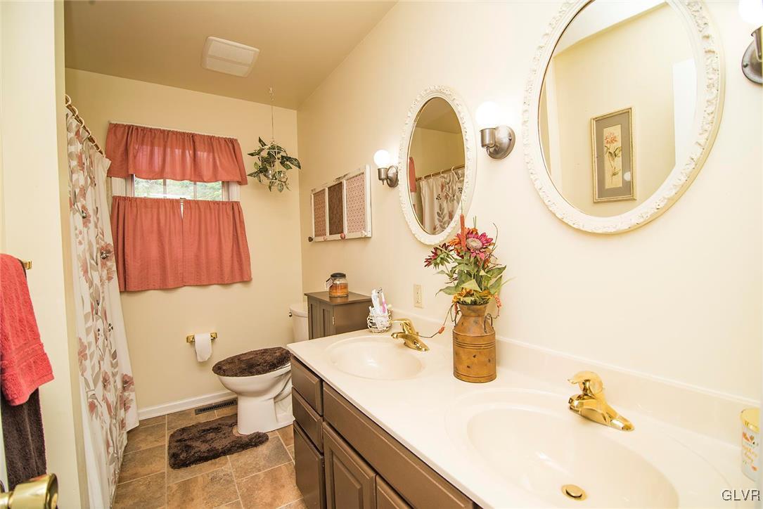 650 Williams Road Nazareth, PA 18064 - Photo 32 of 44 a bathroom with a sink and a mirror