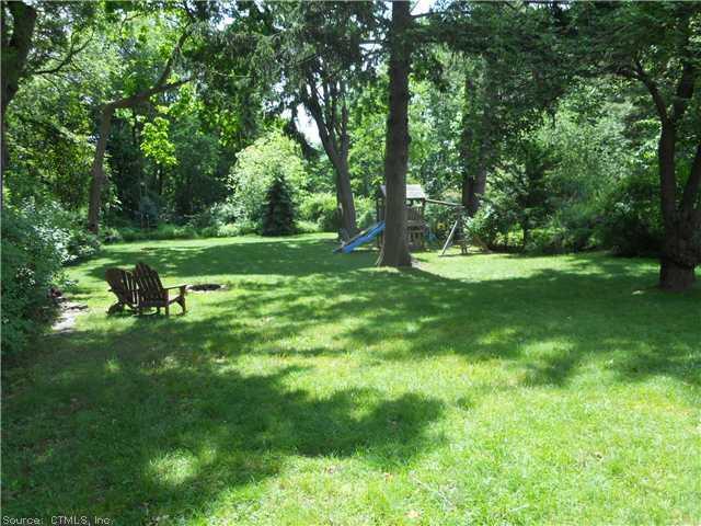 Yard/Garden. Lush large back yard offering great privacy, play scape and fire pit