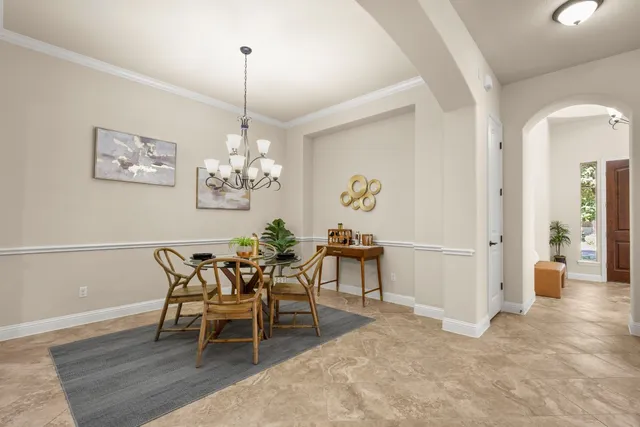 a living room with furniture and kitchen view