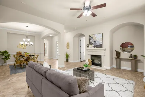 a view of living room with granite countertop furniture and a fireplace