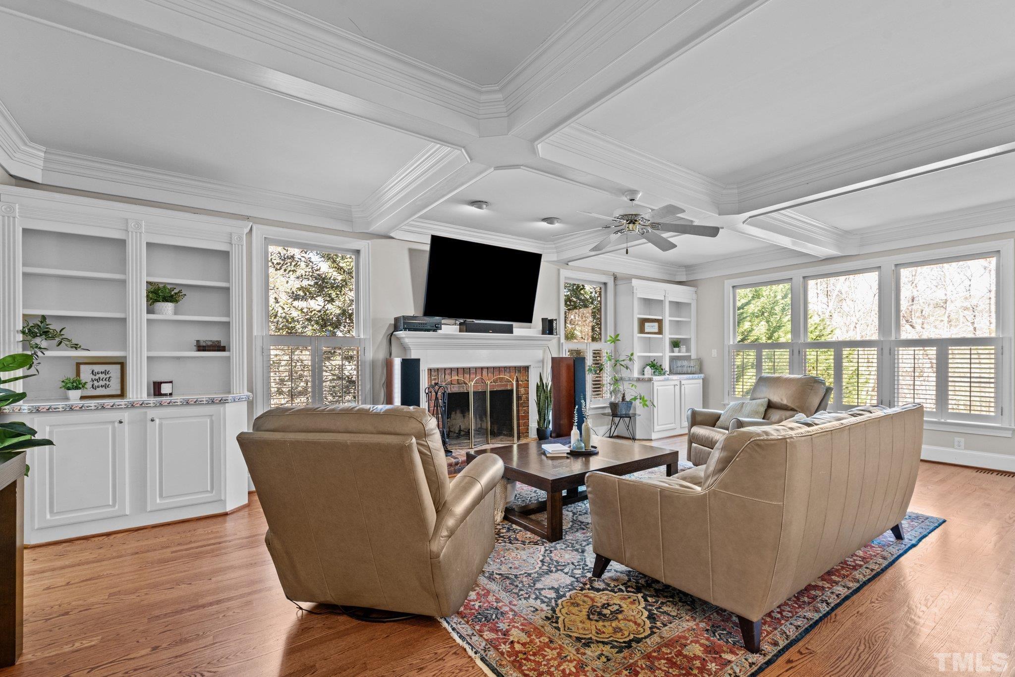 1112 Wagon Ridge Road Raleigh, NC 27614 - Photo 11 of 54 a living room with furniture a fireplace and a flat screen tv