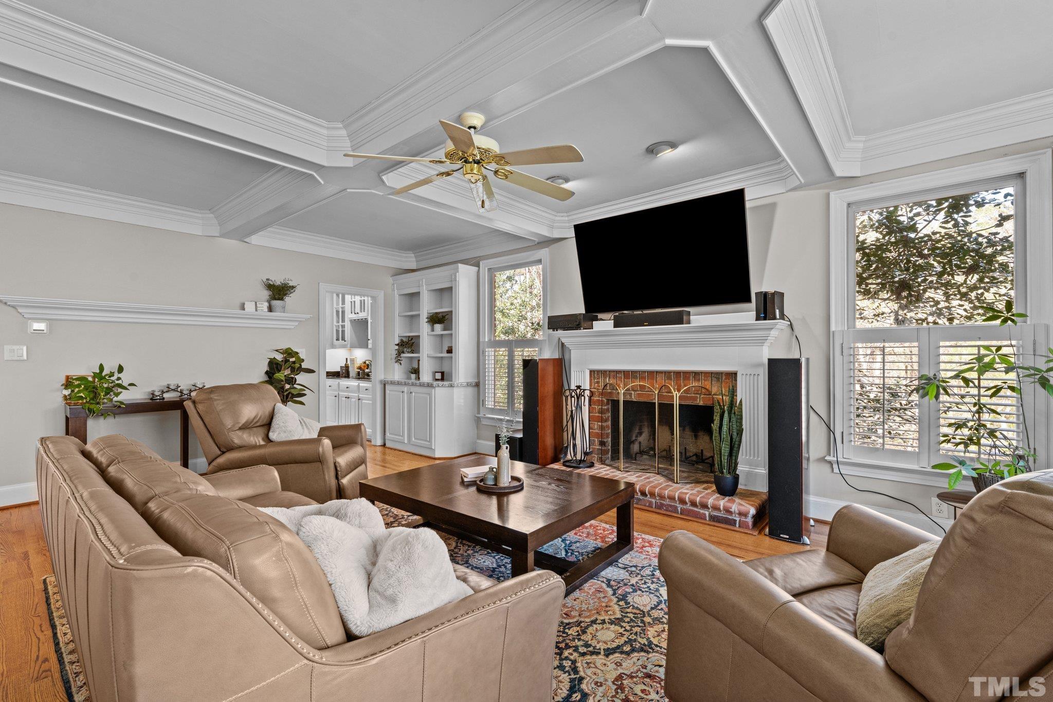 1112 Wagon Ridge Road Raleigh, NC 27614 - Photo 14 of 54 a living room with furniture a fireplace and a flat screen tv