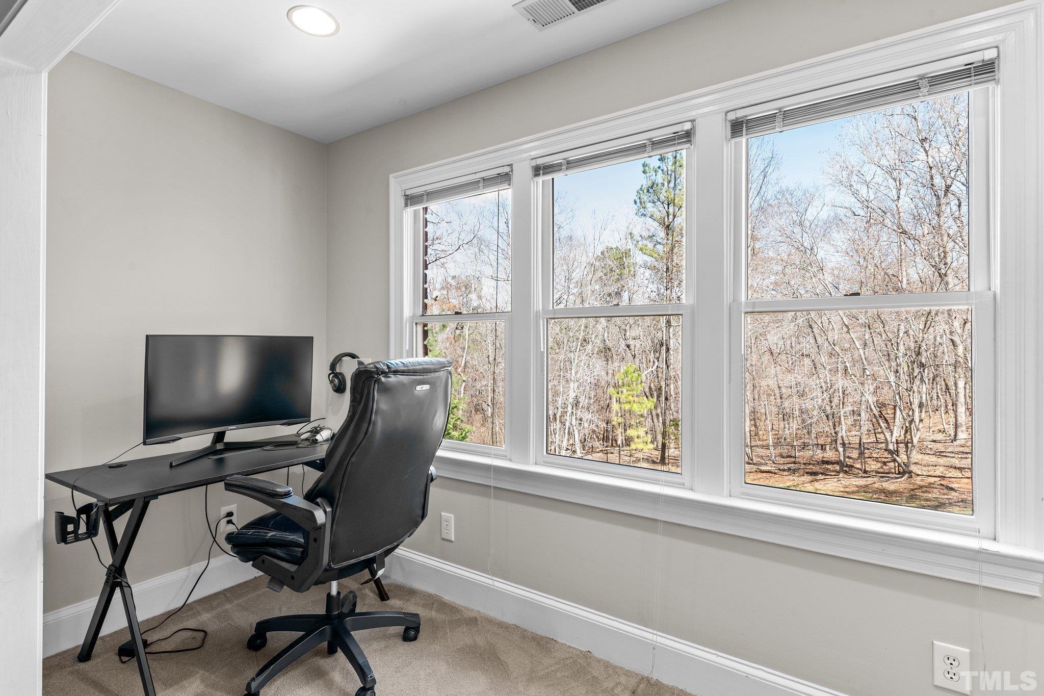 1112 Wagon Ridge Road Raleigh, NC 27614 - Photo 32 of 54 a view of a workspace with furniture and a window