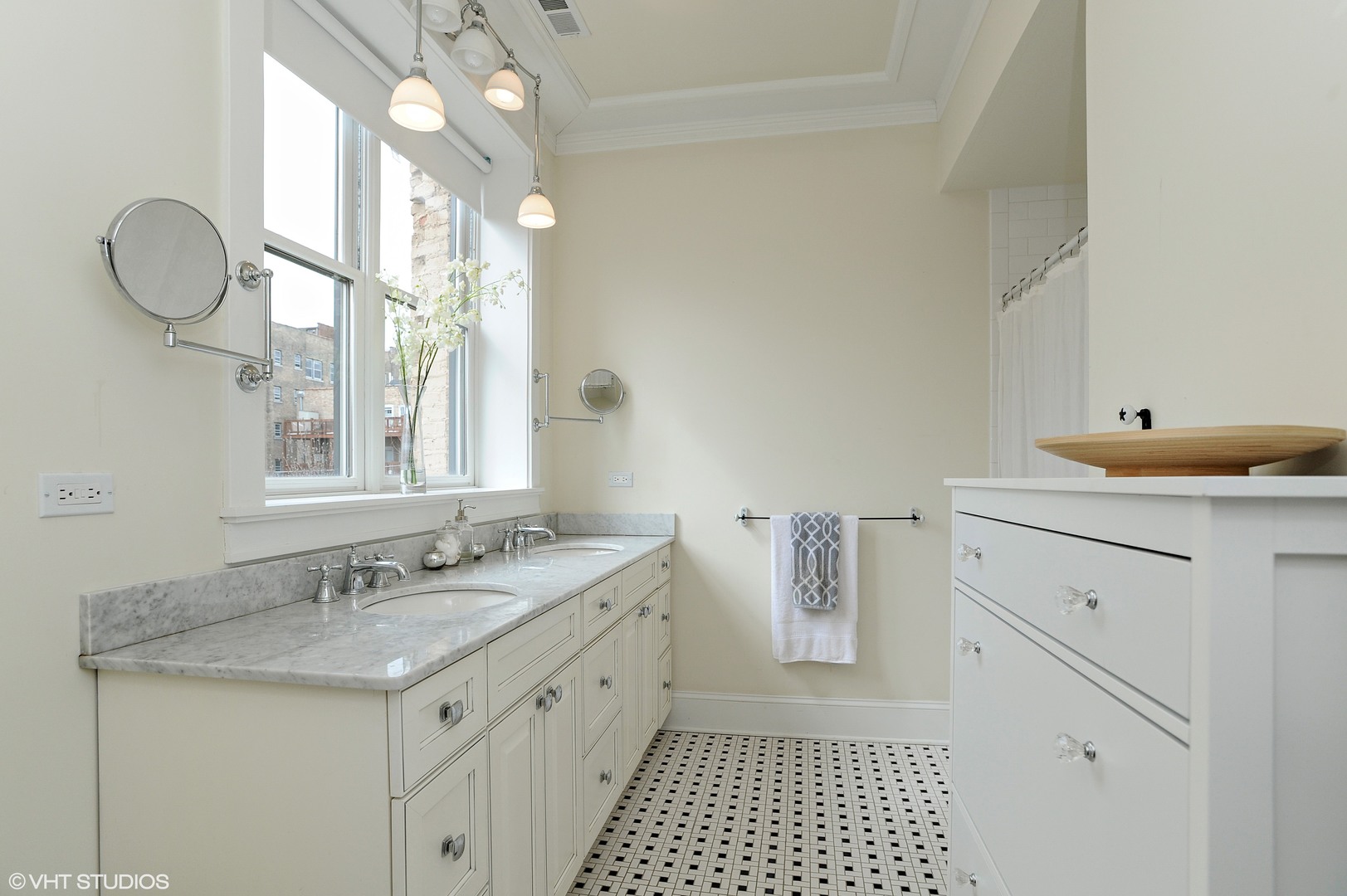 4722 North Malden Street Chicago, IL 60640 - Photo 20 of 42 a bathroom with a granite countertop sink a large mirror and a shower