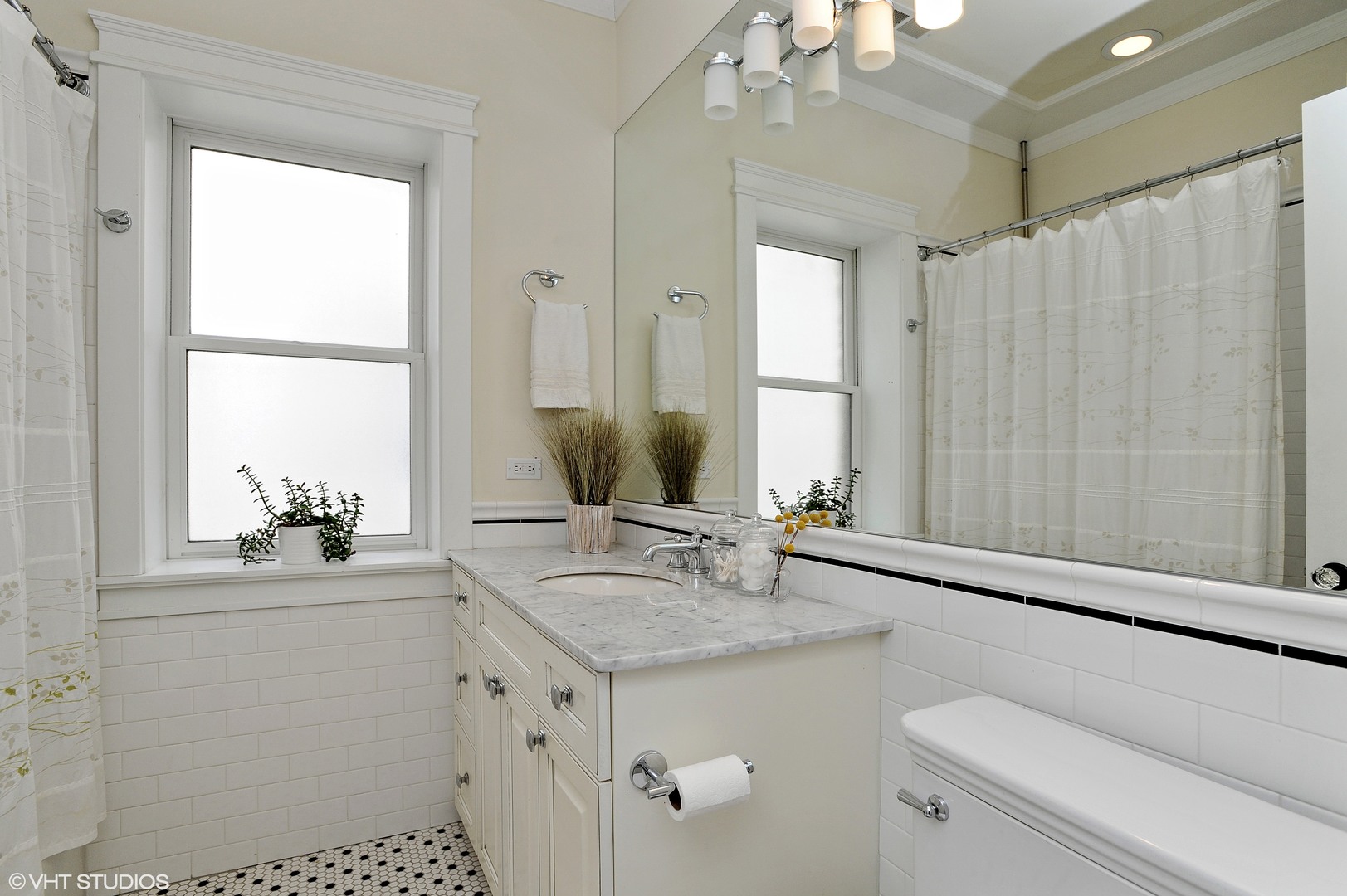 4722 North Malden Street Chicago, IL 60640 - Photo 21 of 42 a bathroom with a sink and a mirror