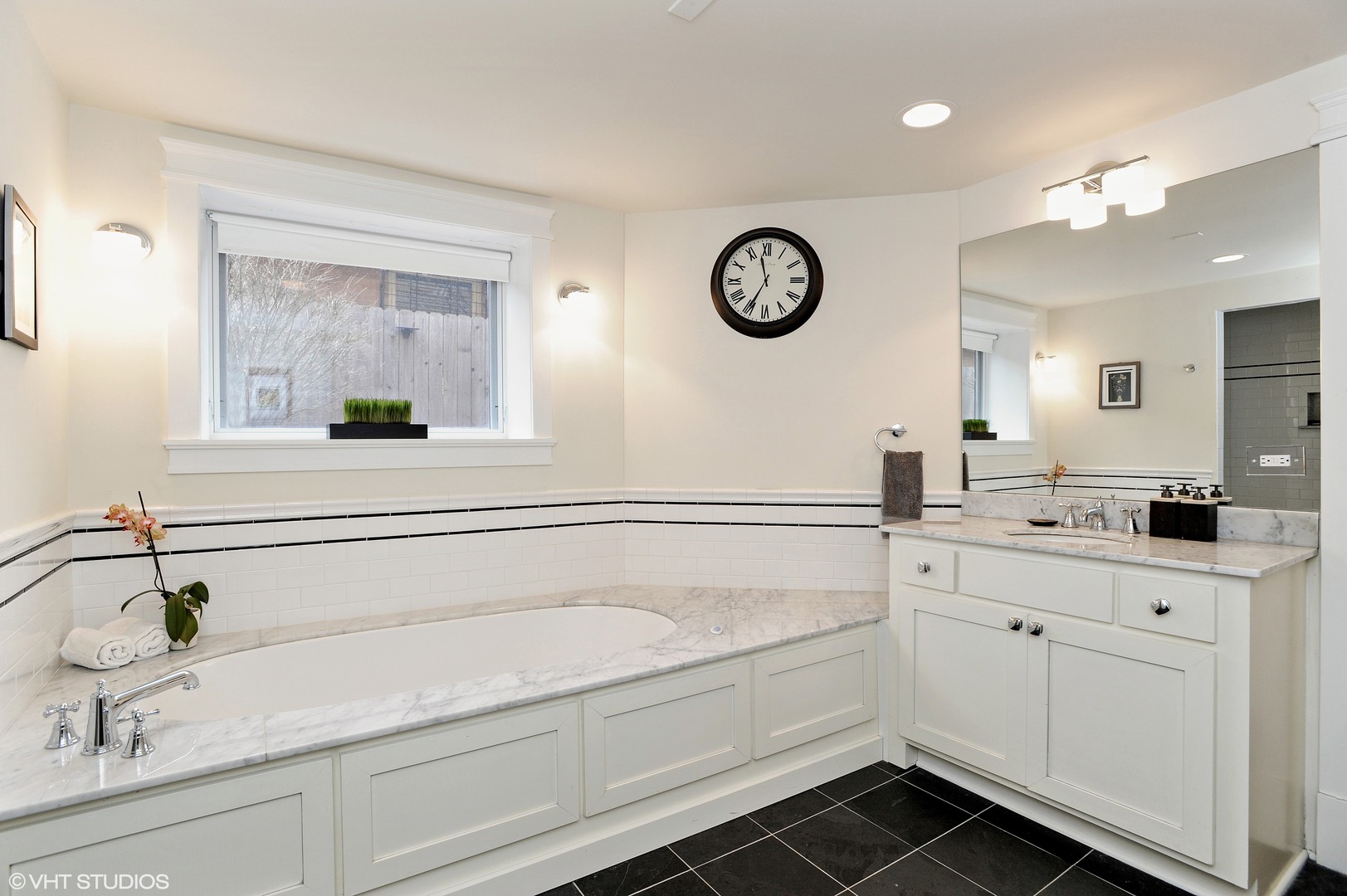 4722 North Malden Street Chicago, IL 60640 - Photo 26 of 42 a bathroom with a sink and a mirror