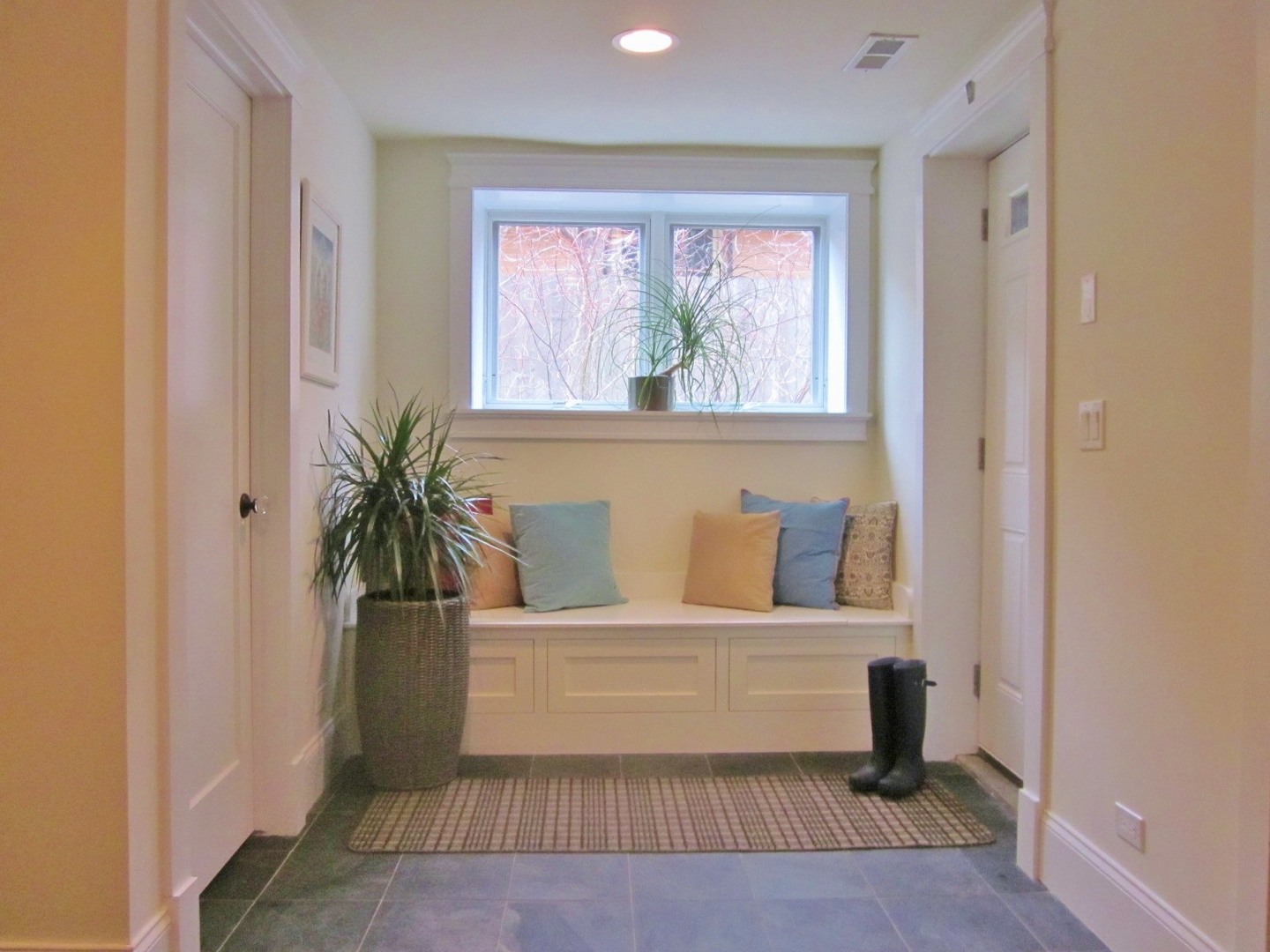 4722 North Malden Street Chicago, IL 60640 - Photo 27 of 42 a living room with a couch and a potted plant