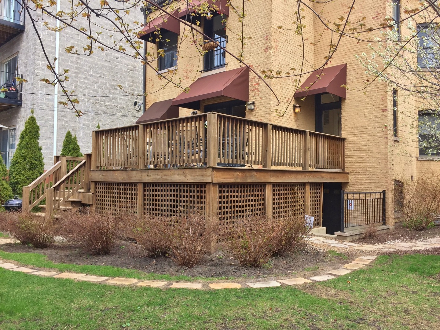 4722 North Malden Street Chicago, IL 60640 - Photo 31 of 42 a view of a house with a yard