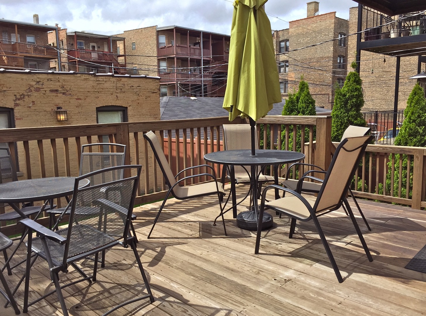 4722 North Malden Street Chicago, IL 60640 - Photo 33 of 42 a view of a balcony with two chairs and a table