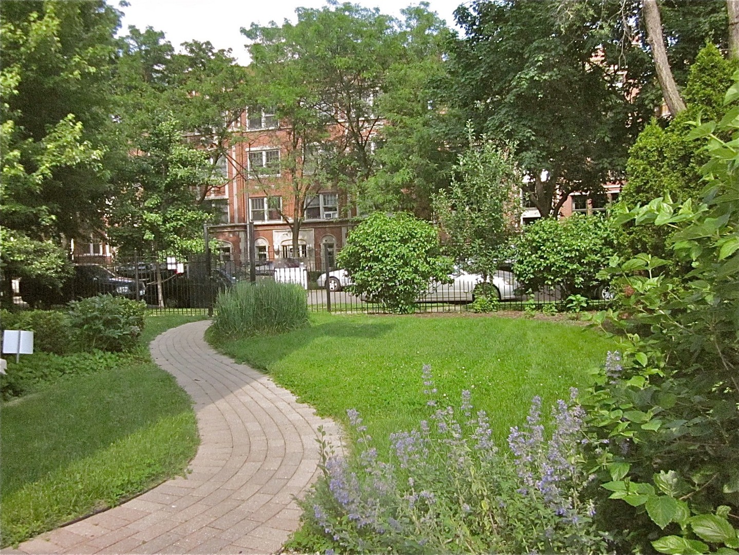 4722 North Malden Street Chicago, IL 60640 - Photo 36 of 42 a view of a garden with a building in the background