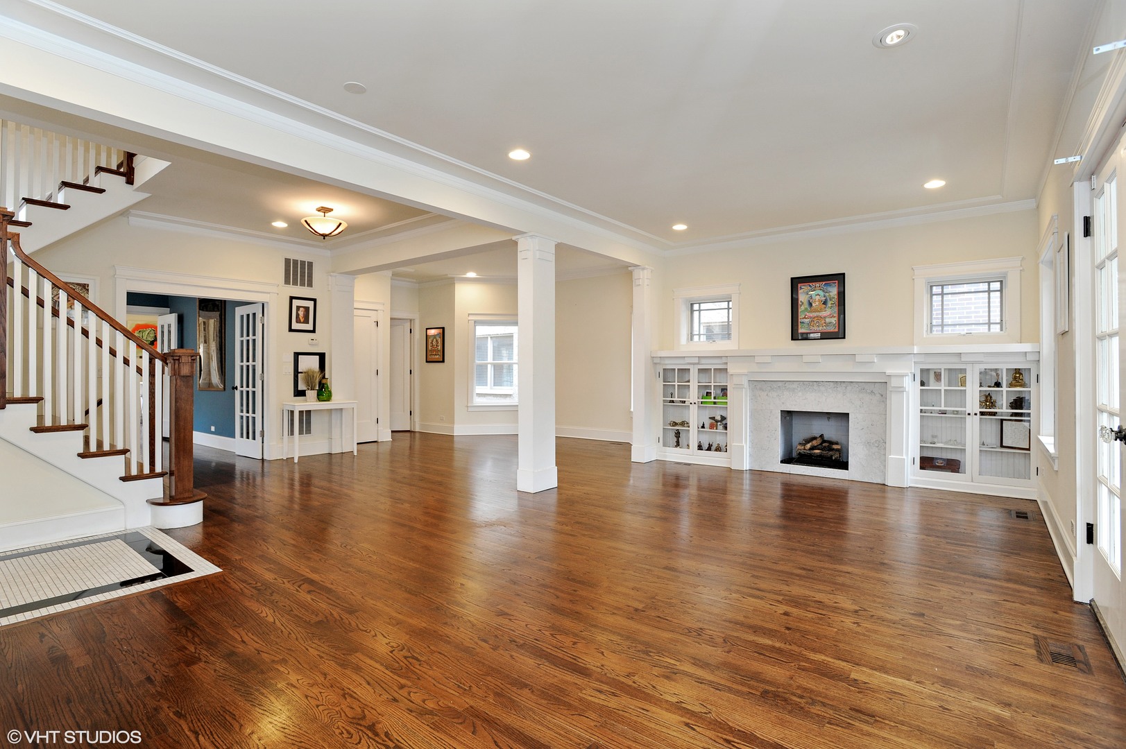 4722 North Malden Street Chicago, IL 60640 - Photo 5 of 42 a view of a livingroom with fireplace wooden floor and furniture