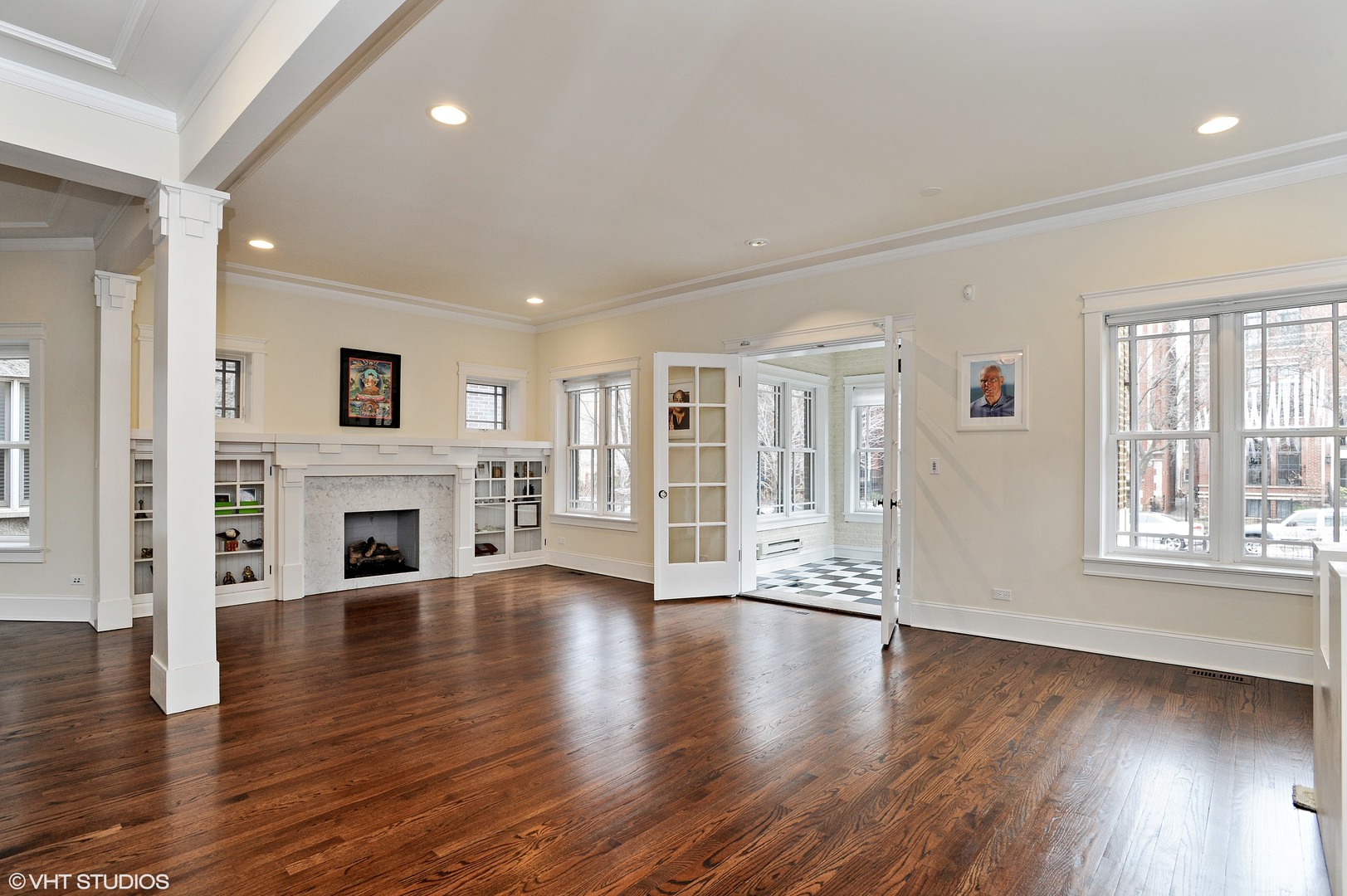 4722 North Malden Street Chicago, IL 60640 - Photo 6 of 42 an empty room with fireplace wooden floor and windows