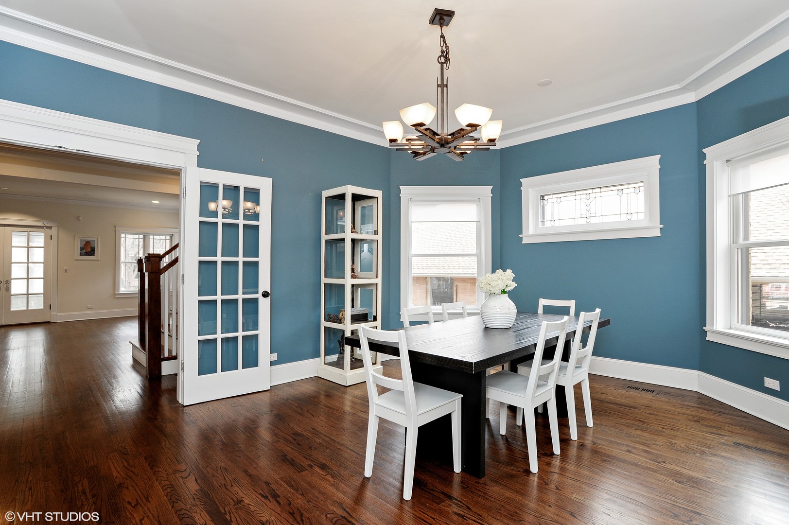 4722 North Malden Street Chicago, IL 60640 - Photo 7 of 42 a view of a dining room with furniture window and wooden floor
