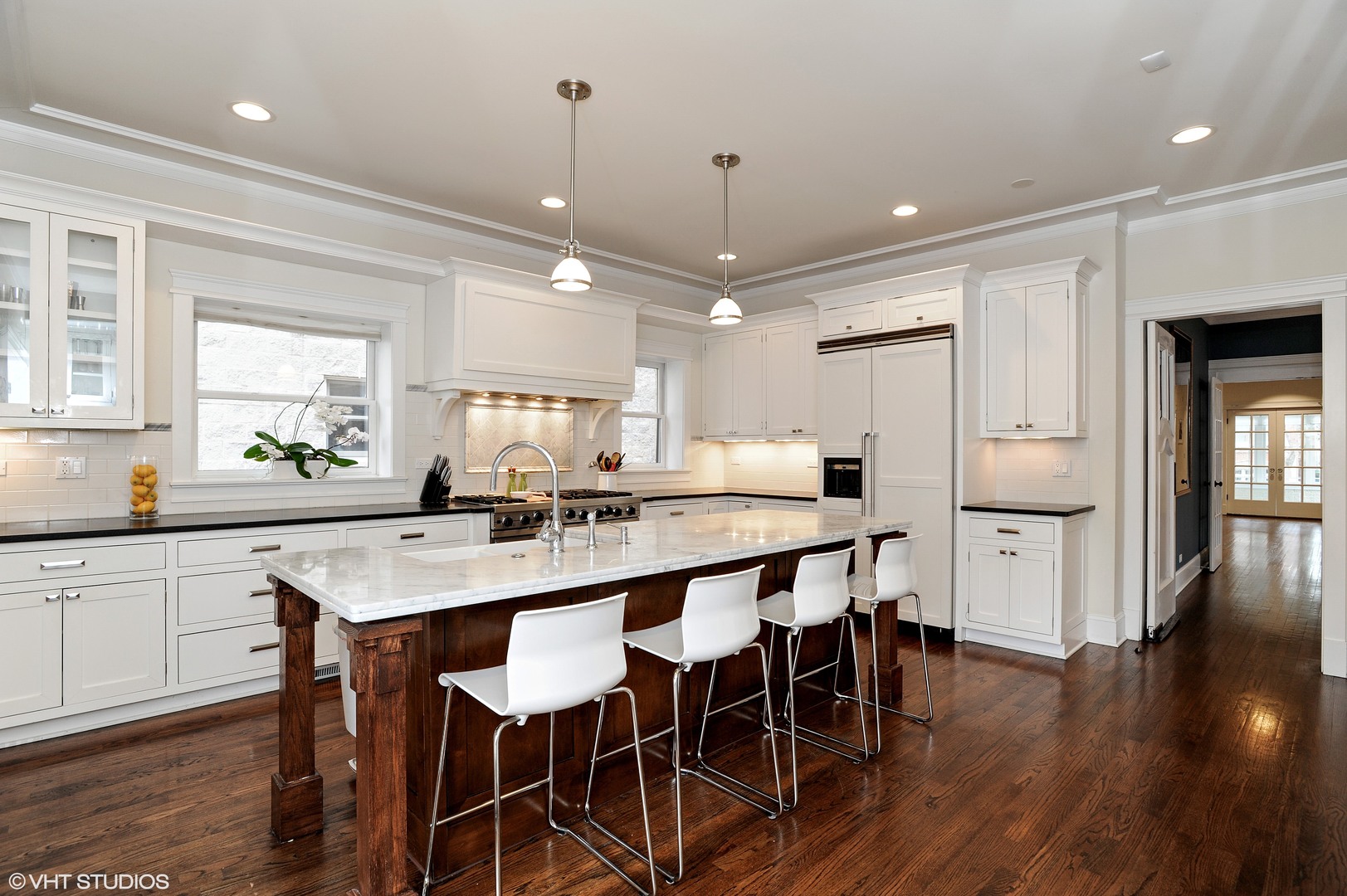 4722 North Malden Street Chicago, IL 60640 - Photo 8 of 42 a large kitchen with a table and chairs