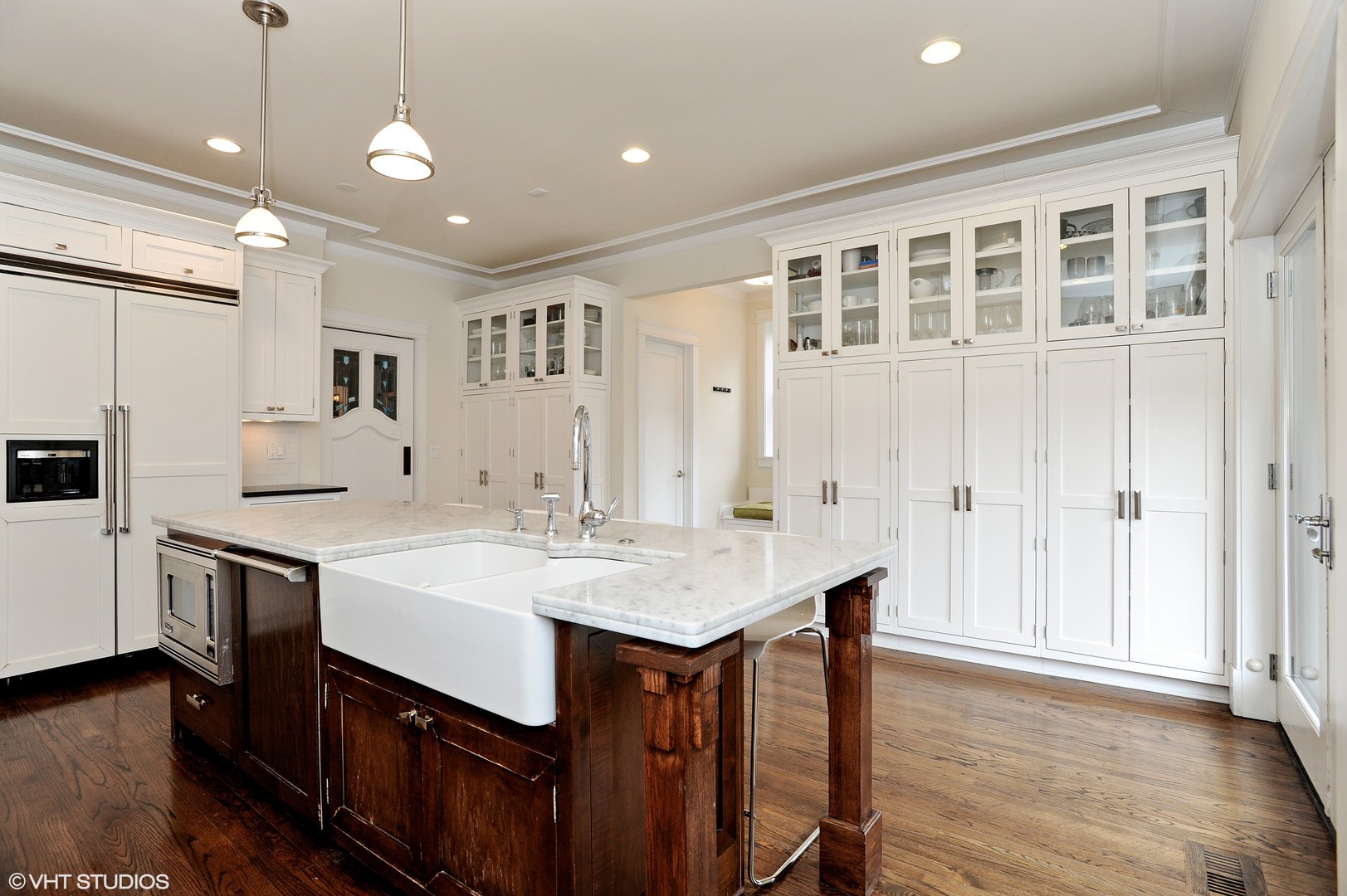 4722 North Malden Street Chicago, IL 60640 - Photo 9 of 42 a kitchen with a sink center island and stainless steel appliances