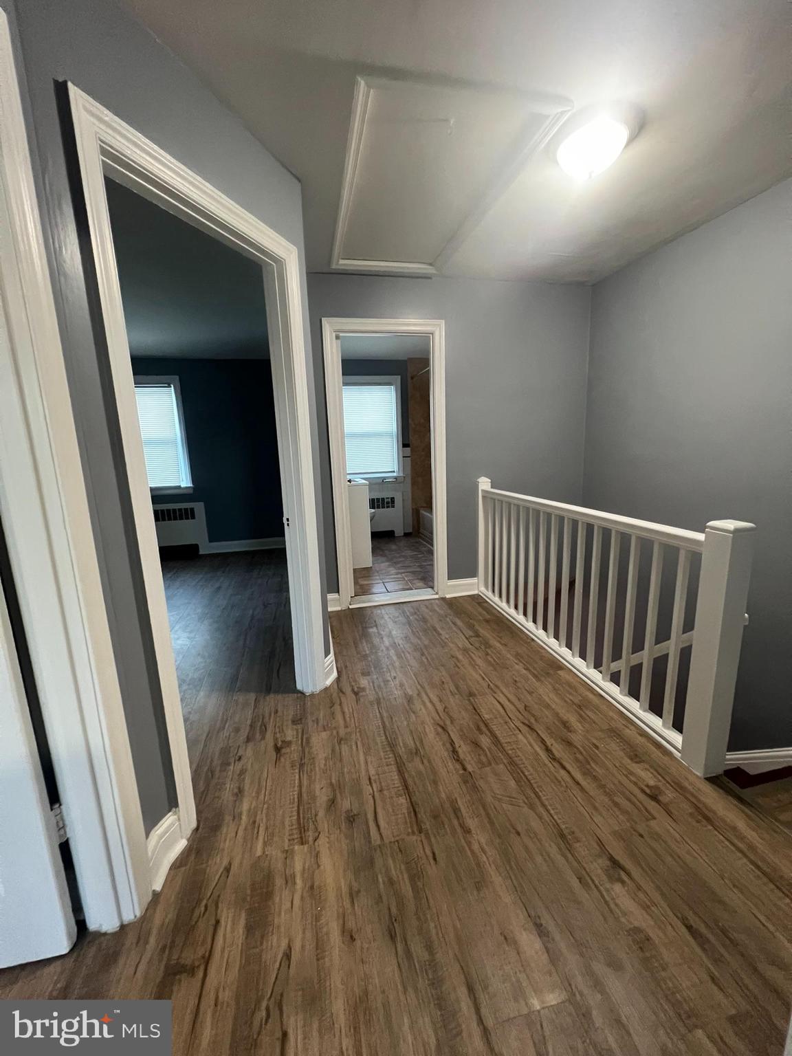 3925 Rexmere Road Baltimore, MD 21218 - Photo 12 of 25 a view of a hallway view with wooden floor and staircase