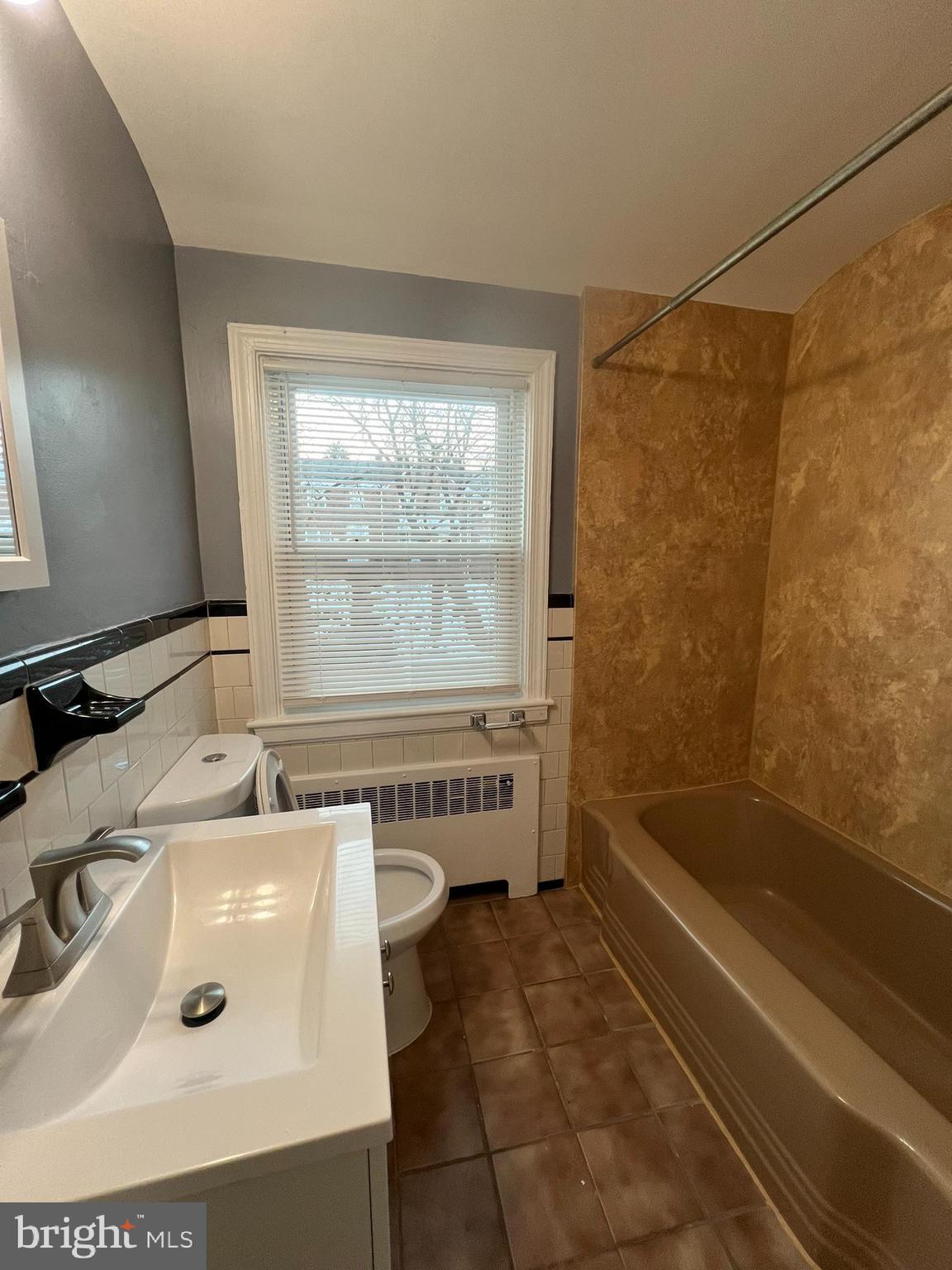 3925 Rexmere Road Baltimore, MD 21218 - Photo 16 of 25 a bathroom with a sink and a bathtub