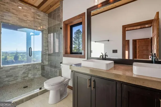 a view of swimming pool with a yard and sitting area