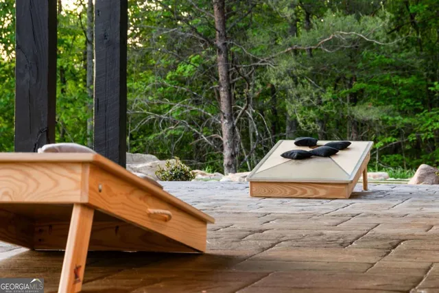 a view of a swimming pool with a patio