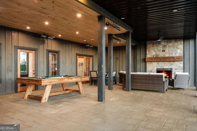 a view of an house with backyard and trees