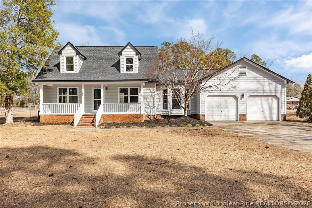 5356 Wade-Stedman Road Wade, NC 28395 - Photo 1 of 38 a front view of a house with a yard
