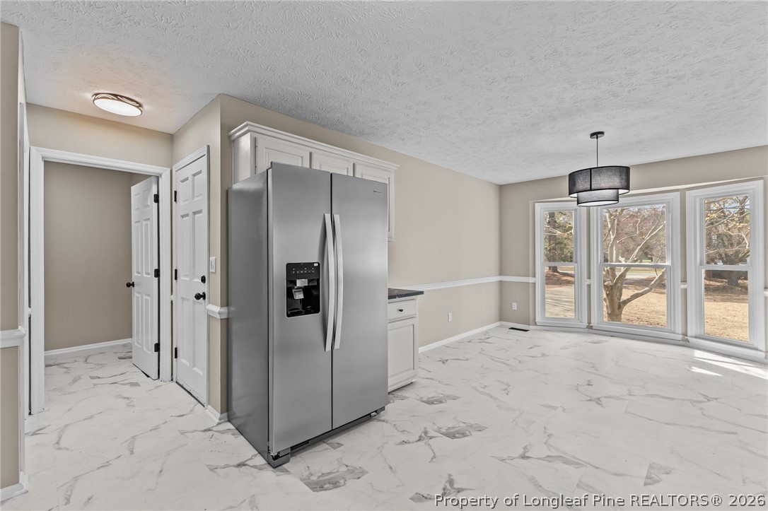 5356 Wade-Stedman Road Wade, NC 28395 - Photo 19 of 38 a view of a big room with windows and closet