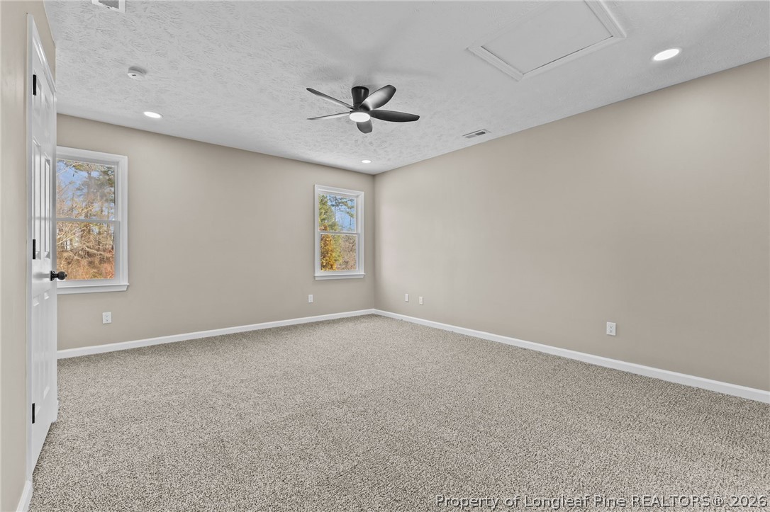5356 Wade-Stedman Road Wade, NC 28395 - Photo 24 of 38 an empty room with windows and fan