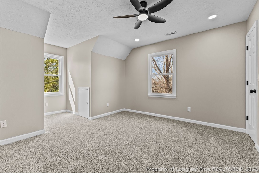 5356 Wade-Stedman Road Wade, NC 28395 - Photo 26 of 38 an empty room with windows and fan