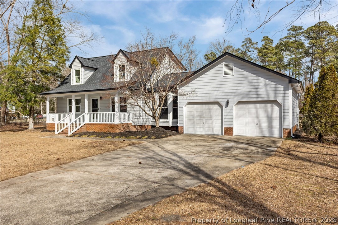 5356 Wade-Stedman Road Wade, NC 28395 - Photo 3 of 38 a front view of a house with a yard