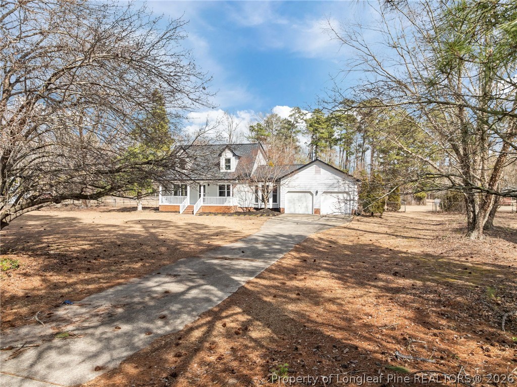 5356 Wade-Stedman Road Wade, NC 28395 - Photo 34 of 38 a view of house with snow on the road