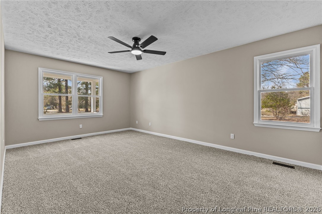 5356 Wade-Stedman Road Wade, NC 28395 - Photo 10 of 38 a view of an empty room with a window