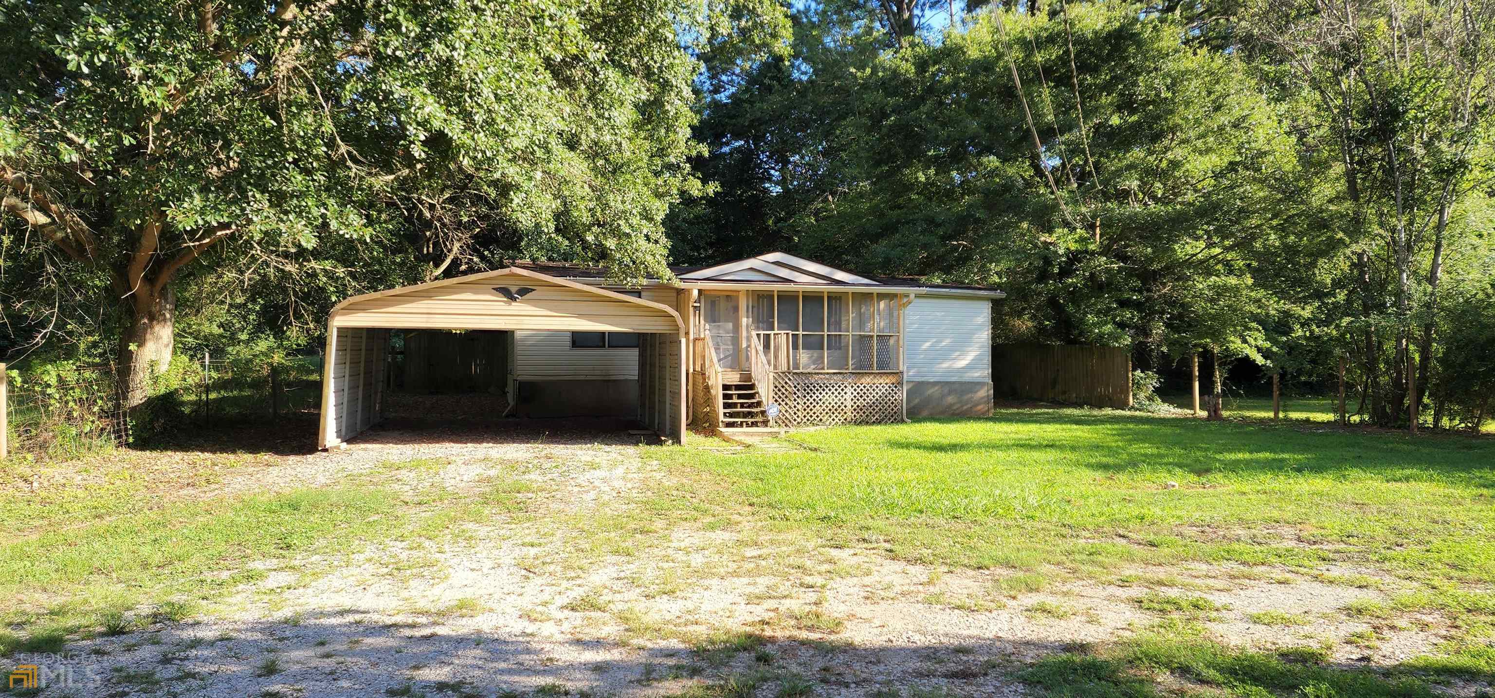 82 Rustic Road Stockbridge, GA 30281 - Photo 1 of 1 a front view of a house with a yard