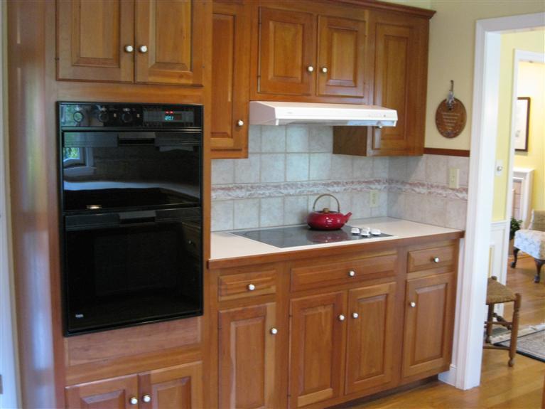 283 Round Cove Road Chatham, MA 02633 - Photo 12 of 24 a kitchen with stainless steel appliances granite countertop a stove and a microwave