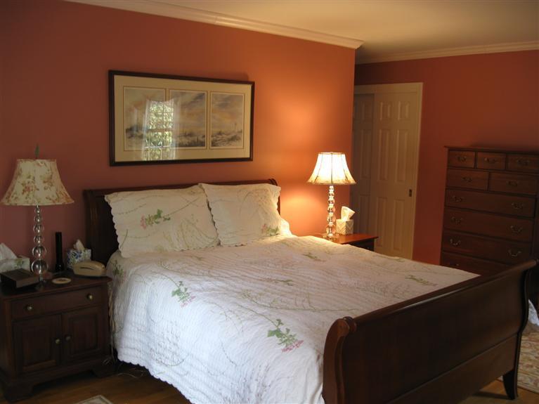 283 Round Cove Road Chatham, MA 02633 - Photo 14 of 24 a bedroom with a bed and a lamp