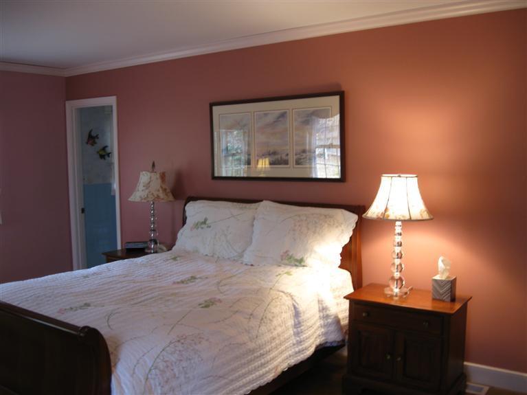 283 Round Cove Road Chatham, MA 02633 - Photo 15 of 24 a bedroom with a bed and a lamp on table