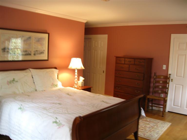 283 Round Cove Road Chatham, MA 02633 - Photo 16 of 24 a bedroom with a bed and a painting on the wall