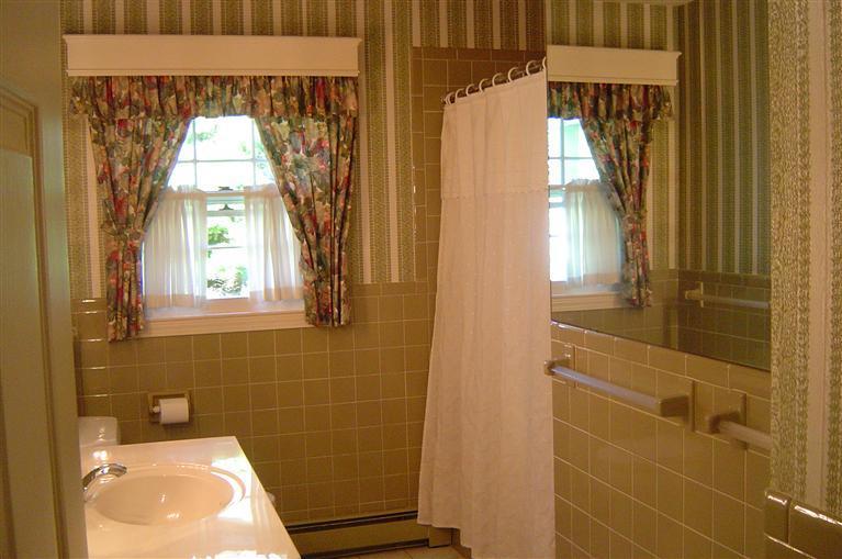 283 Round Cove Road Chatham, MA 02633 - Photo 17 of 24 a bathroom with a toilet and a window