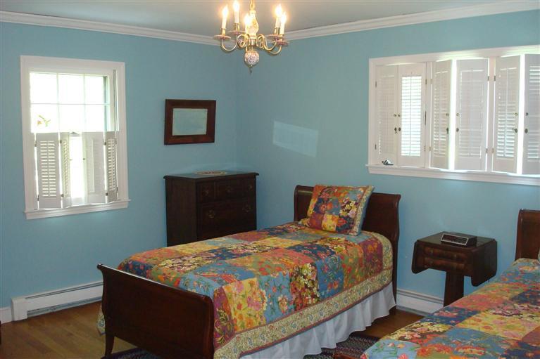 283 Round Cove Road Chatham, MA 02633 - Photo 18 of 24 a bed sitting in a bedroom next to a window