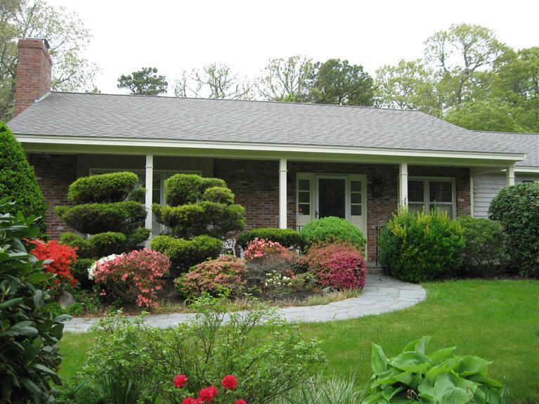 283 Round Cove Road Chatham, MA 02633 - Photo 23 of 24 a front view of house with yard and green space