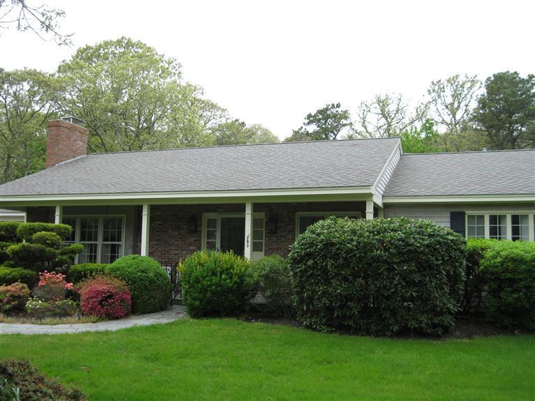 283 Round Cove Road Chatham, MA 02633 - Photo 24 of 24 front view of a house with a garden