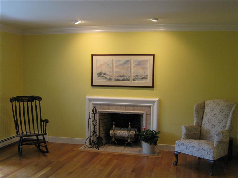 283 Round Cove Road Chatham, MA 02633 - Photo 8 of 24 a living room with furniture and a fireplace