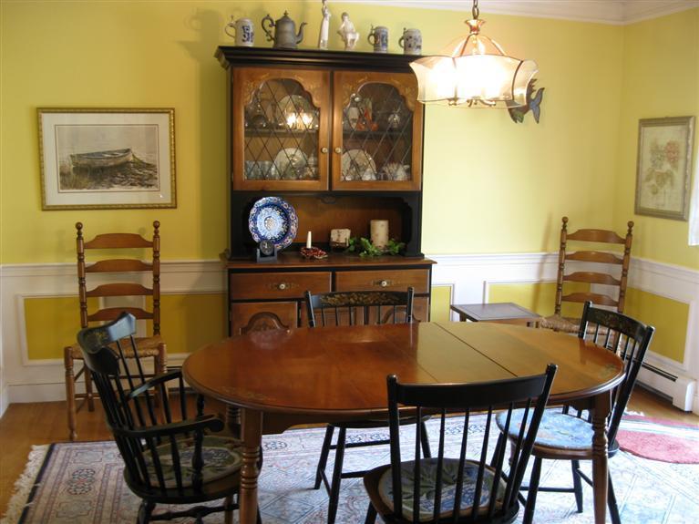 283 Round Cove Road Chatham, MA 02633 - Photo 9 of 24 a view of a dining room with furniture and chandelier