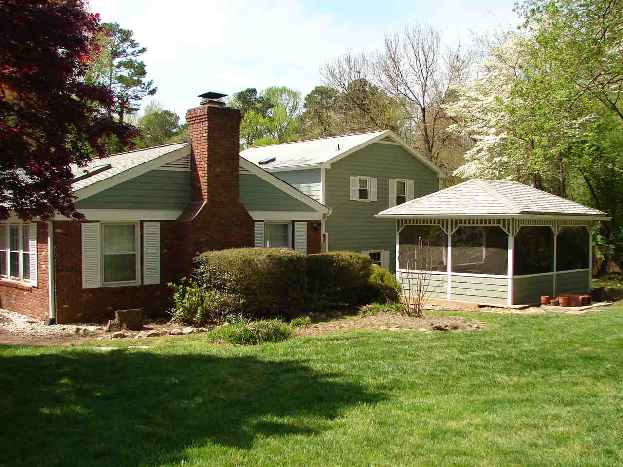 409 Vernon Terrace Raleigh, NC 27609 - Photo 15 of 23 Lovely Open Grassy area with Screened Gazebo that is Wired for Sound and has Electrical Outlet. Exterior Back